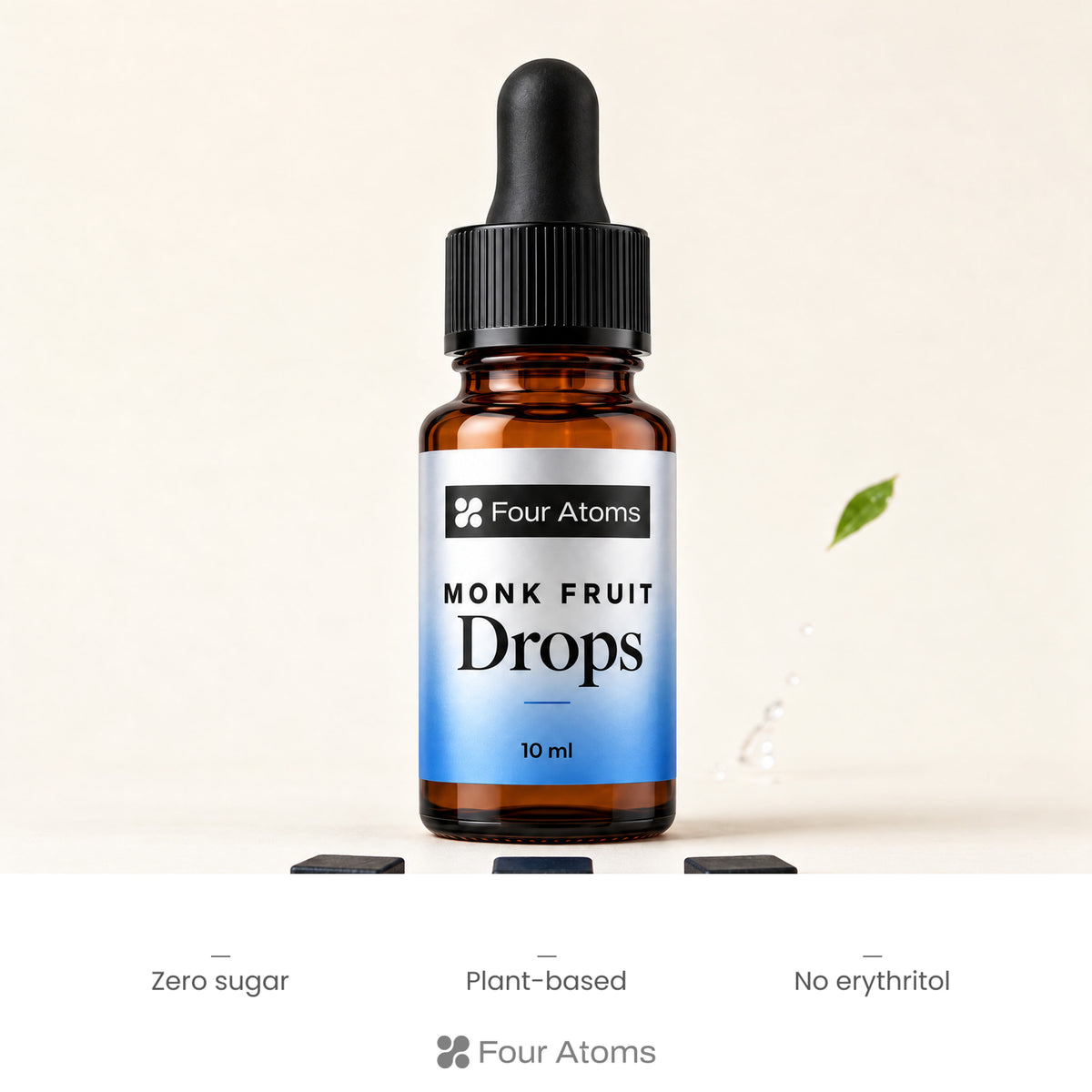 Four Atoms monk fruit drops bottle beside a cup of chai