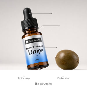 Dropper held over a cup of coffee with Four Atoms monk fruit drops